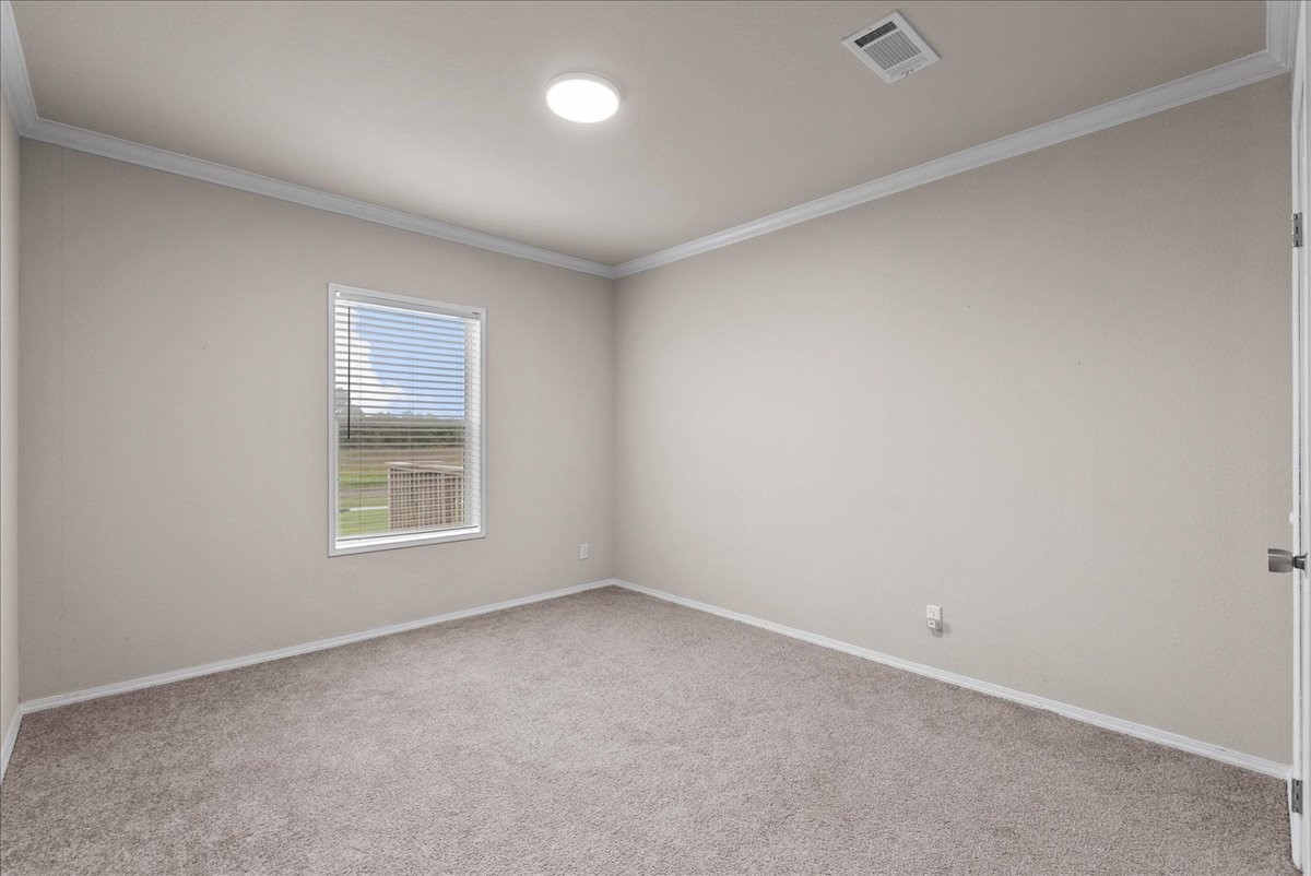 8710 Fm 646 Road South Santa Fe, TX 77510 - Photo 15 of 32 Second bedroom featuring ample natural lighting