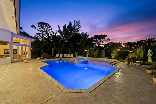 a view of swimming pool with outdoor seating