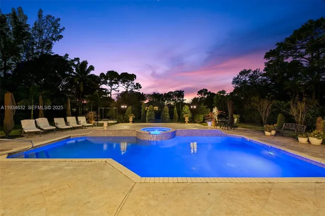 a living room with furniture a rug and a swimming pool