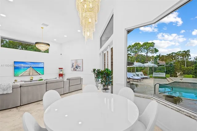 a bathroom with a granite countertop tub sink shower and mirror