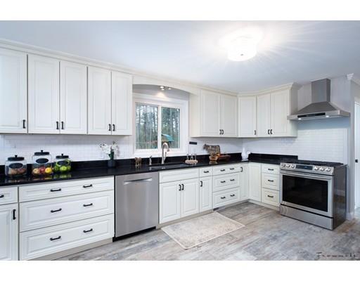17 Mill Run Road Boxford, MA 01921 - Photo 11 of 26 a kitchen with granite countertop white cabinets and stainless steel appliances