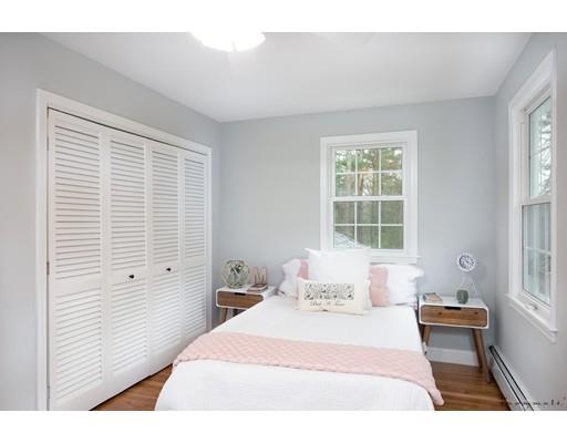 17 Mill Run Road Boxford, MA 01921 - Photo 24 of 26 a bedroom with a bed and a large window