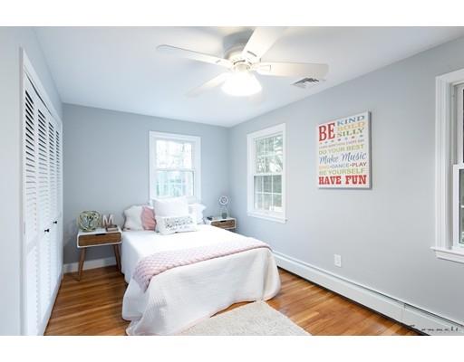 17 Mill Run Road Boxford, MA 01921 - Photo 25 of 26 a bedroom with a bed wooden floor and window
