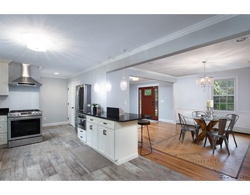 17 Mill Run Road Boxford, MA 01921 - Photo 9 of 26 a kitchen with stainless steel appliances kitchen island granite countertop a stove and a sink