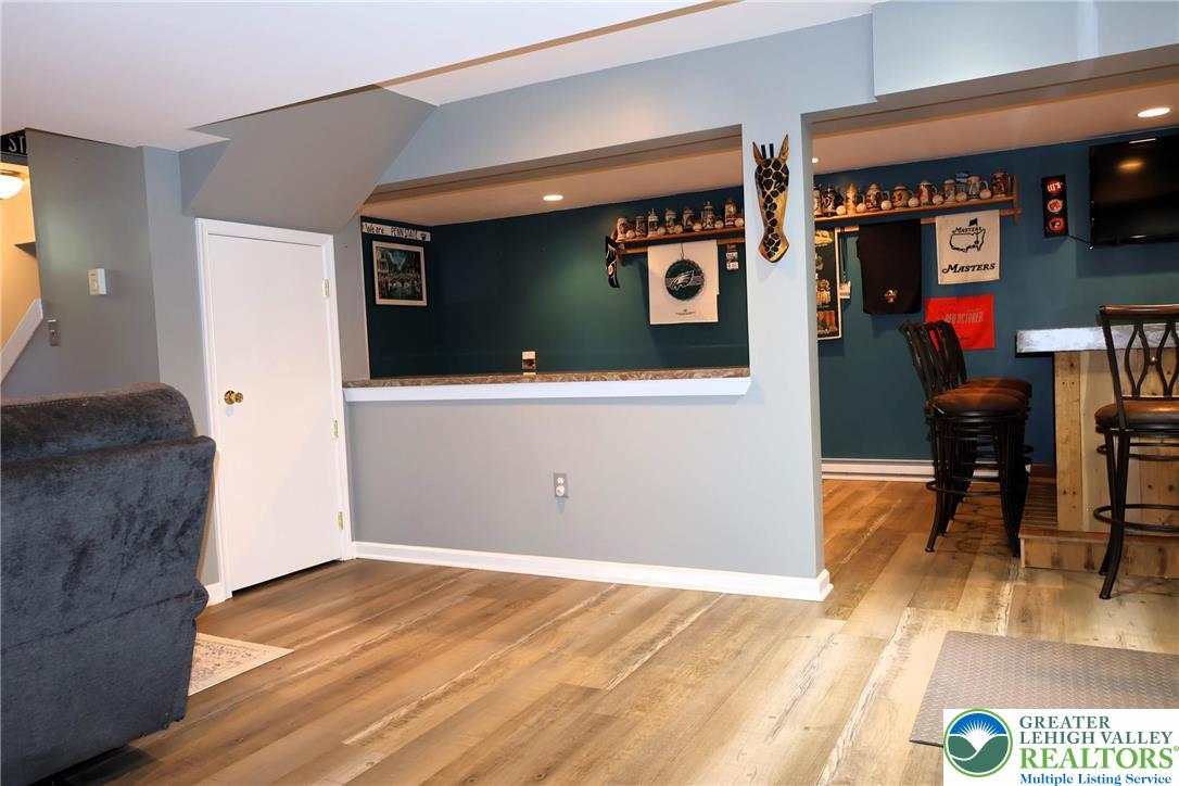 396 Anthony Drive Northampton, PA 18067 - Photo 16 of 35 a view of a hallway with wooden floor and furniture