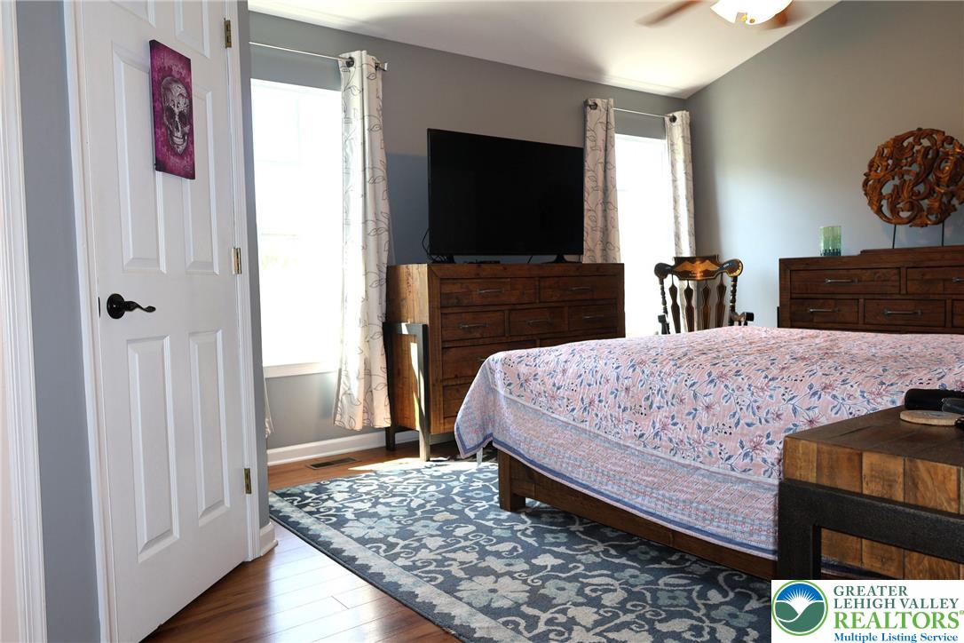 396 Anthony Drive Northampton, PA 18067 - Photo 19 of 35 a bedroom with a bed and a flat screen television