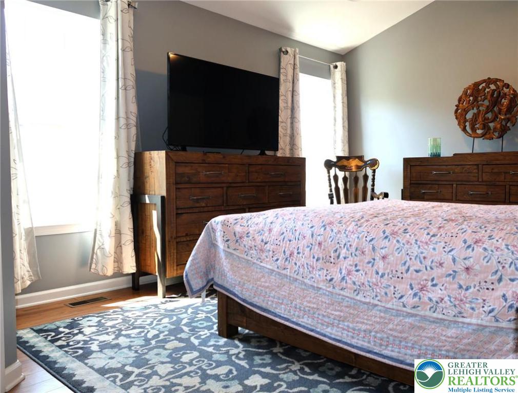 396 Anthony Drive Northampton, PA 18067 - Photo 22 of 35 a bedroom with a bed and flat screen tv