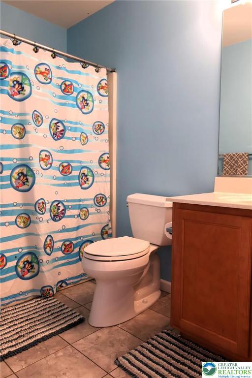 396 Anthony Drive Northampton, PA 18067 - Photo 24 of 35 a white toilet sitting next to a road with a rug