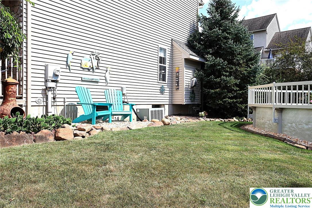 396 Anthony Drive Northampton, PA 18067 - Photo 33 of 35 a backyard of a house with table and chairs