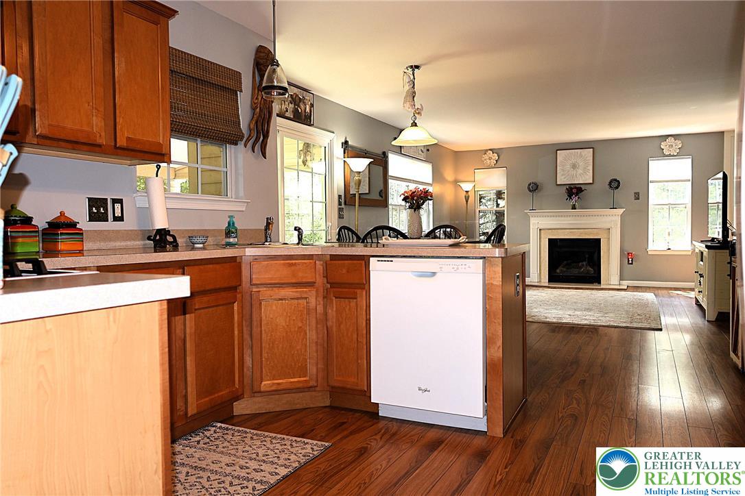 396 Anthony Drive Northampton, PA 18067 - Photo 10 of 35 a kitchen with stainless steel appliances granite countertop a stove a sink dishwasher and a refrigerator with wooden floor