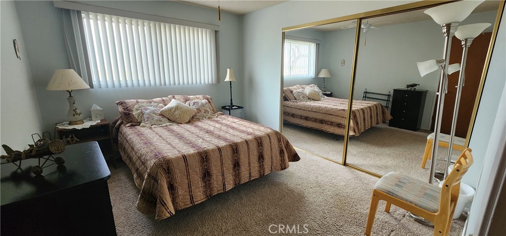 12491 Toby Lane Blythe, CA 92225 - Photo 14 of 41 a bedroom with a bed and a mirror