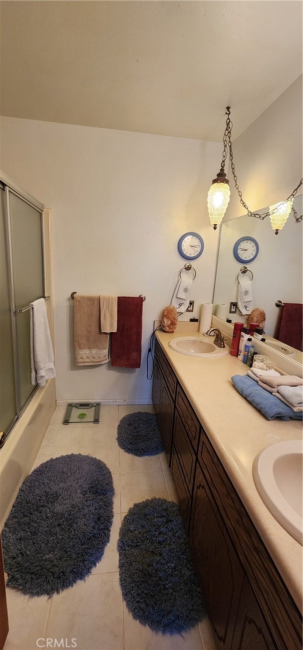 12491 Toby Lane Blythe, CA 92225 - Photo 15 of 41 a bathroom with a sink vanity and a mirror