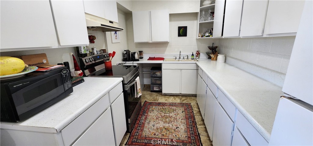 12491 Toby Lane Blythe, CA 92225 - Photo 23 of 41 a room with storage and utility