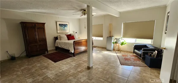 a room with a bed and a mirror