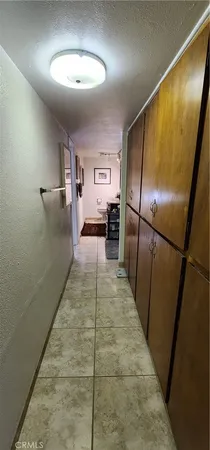 a bed room with a bed and a television