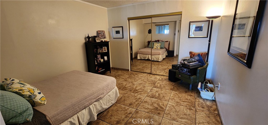 12491 Toby Lane Blythe, CA 92225 - Photo 28 of 41 a bed room with a bed and a television