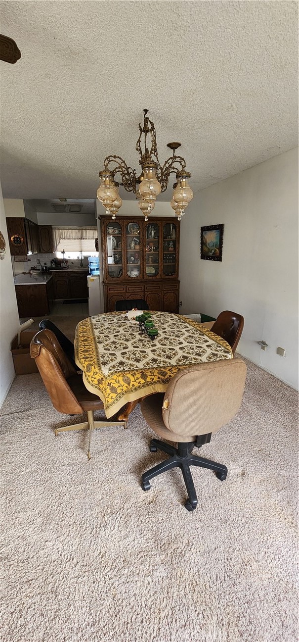 12491 Toby Lane Blythe, CA 92225 - Photo 9 of 41 a living room with furniture pool table and chairs