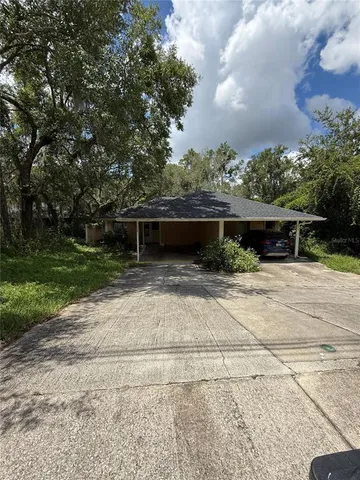 a backyard of a house with lots of green space