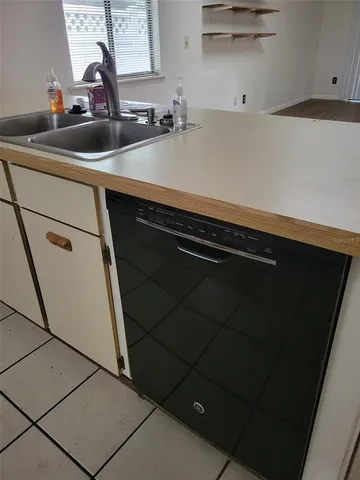 a kitchen with a sink and cabinets