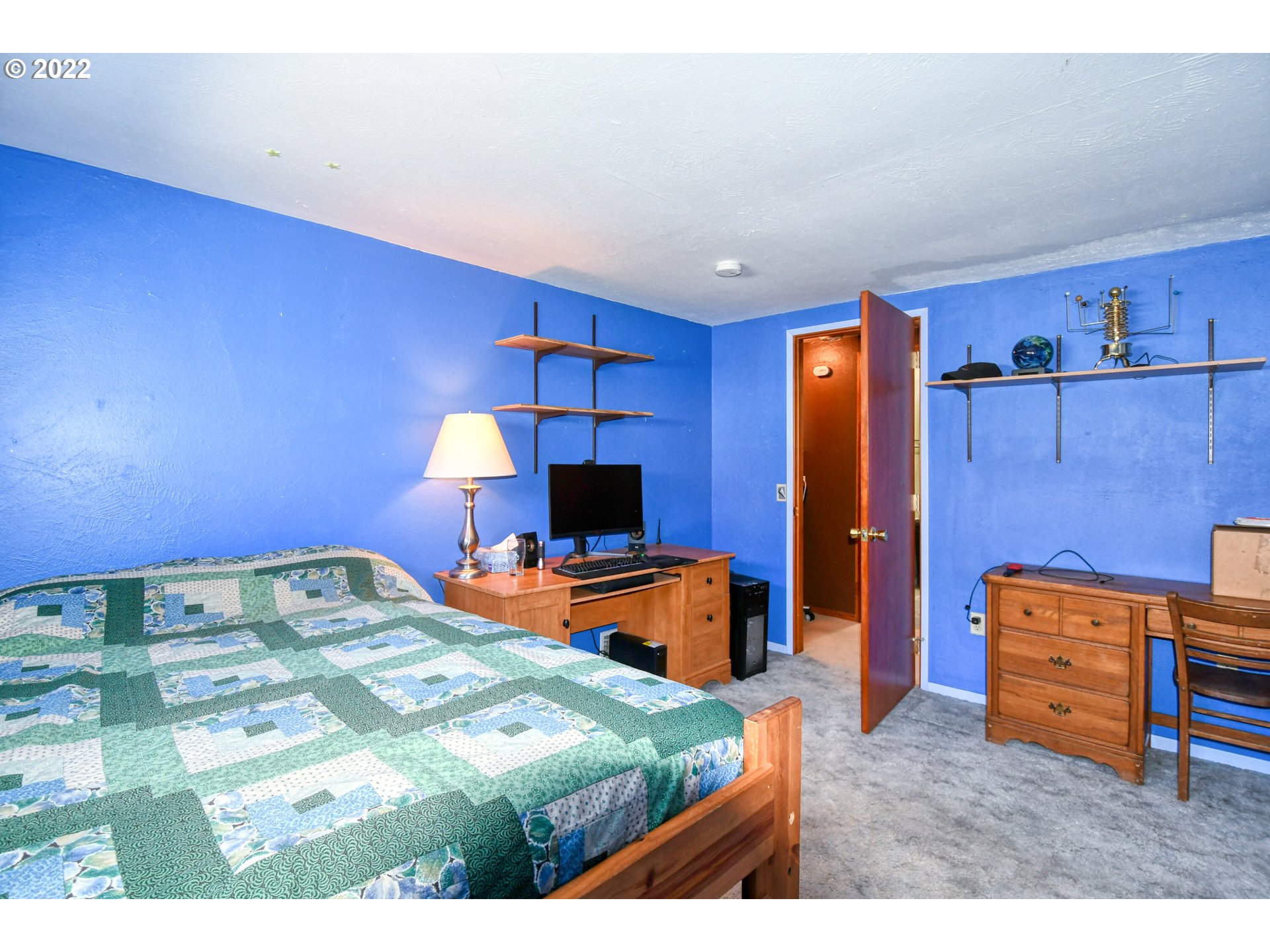 2917 Southwest Ladow Avenue Pendleton, OR 97801 - Photo 19 of 31 a bedroom with a bed and a television