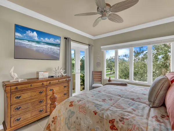 a bedroom with a bed and a lamp on table