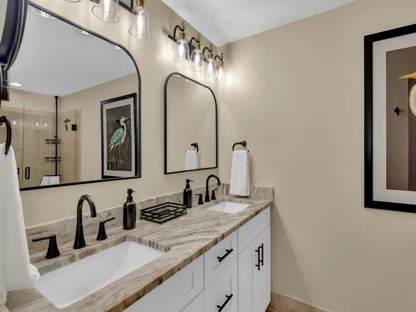 a bathroom with a bathtub and a shower