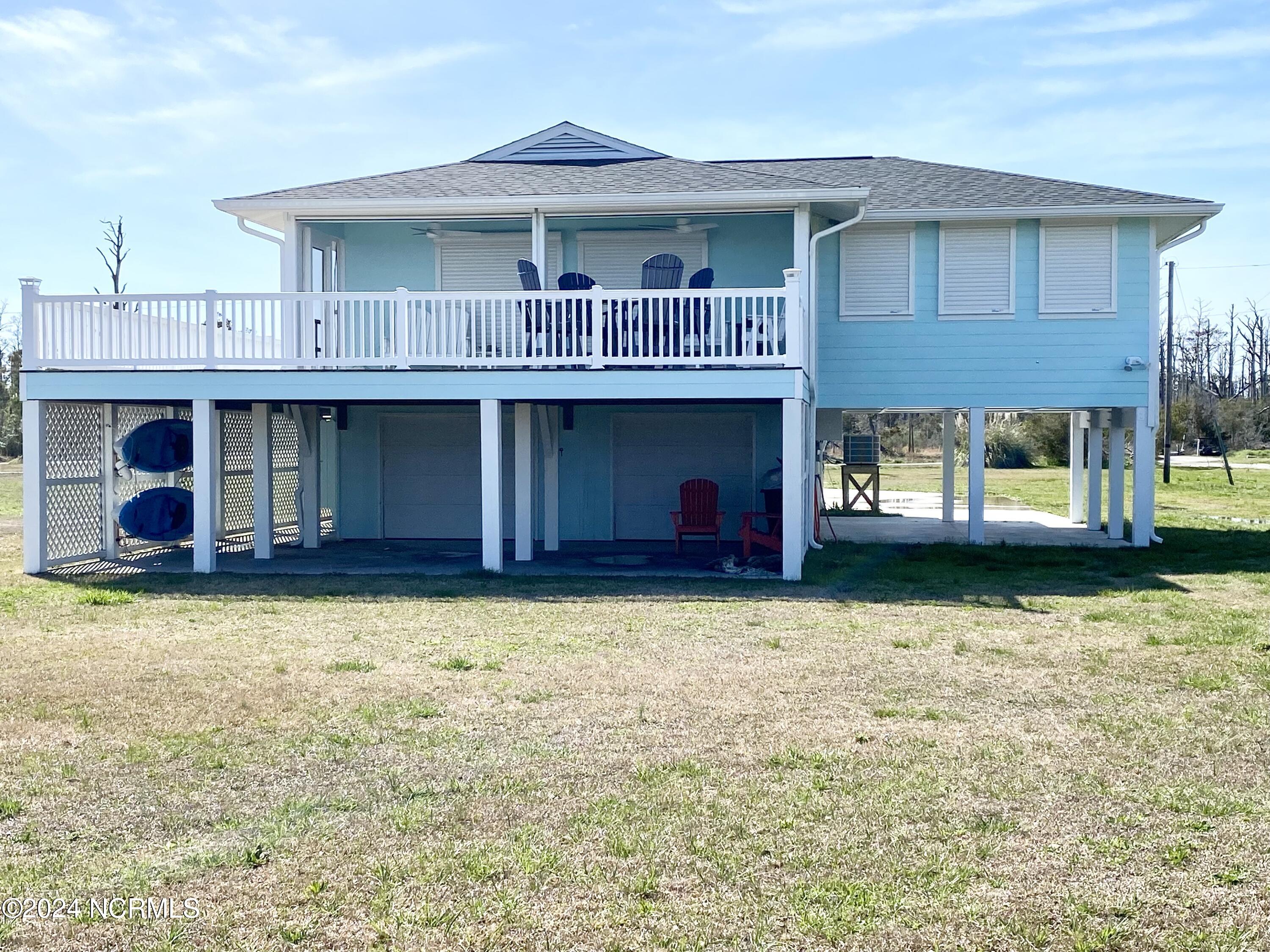 152 Taylor Road Marshallberg, NC 28553 - Photo 45 of 46 Hurricane shutters on the back