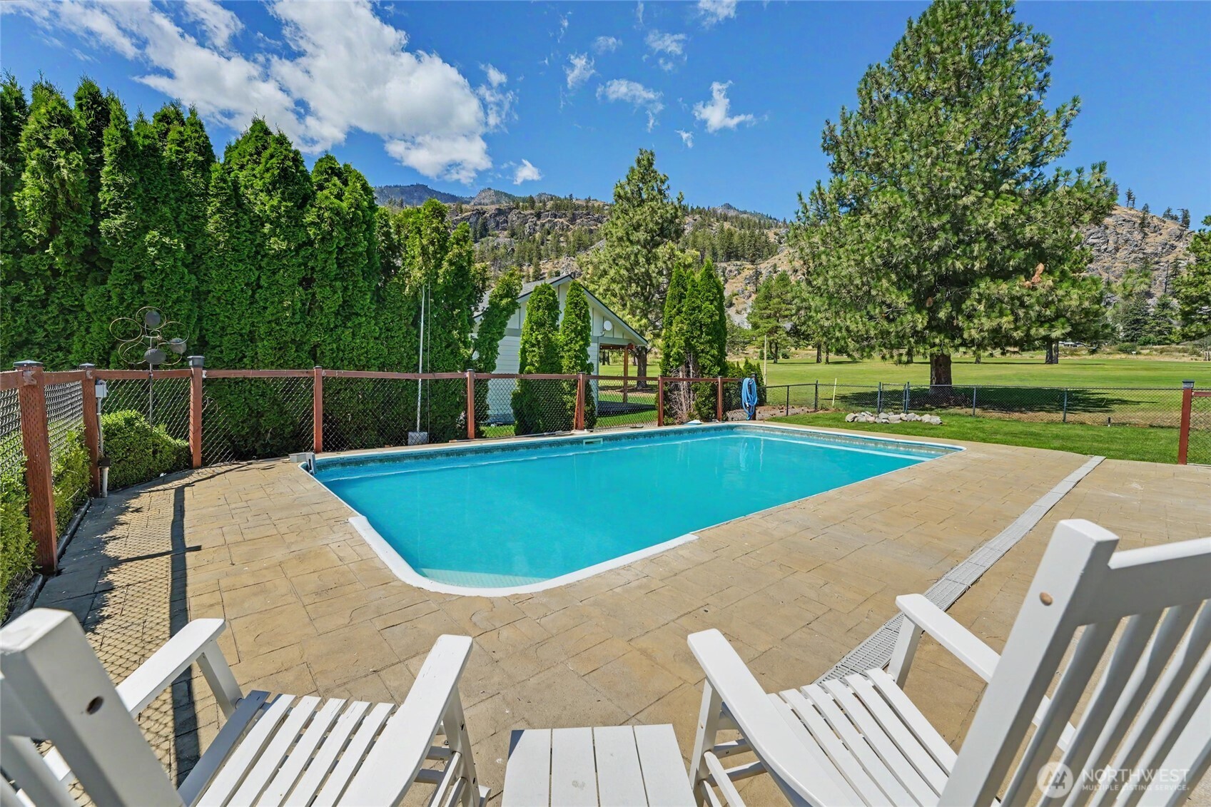 93 Golf Course Drive Pateros, WA 98846 - Photo 24 of 34 a view of outdoor space and swimming pool