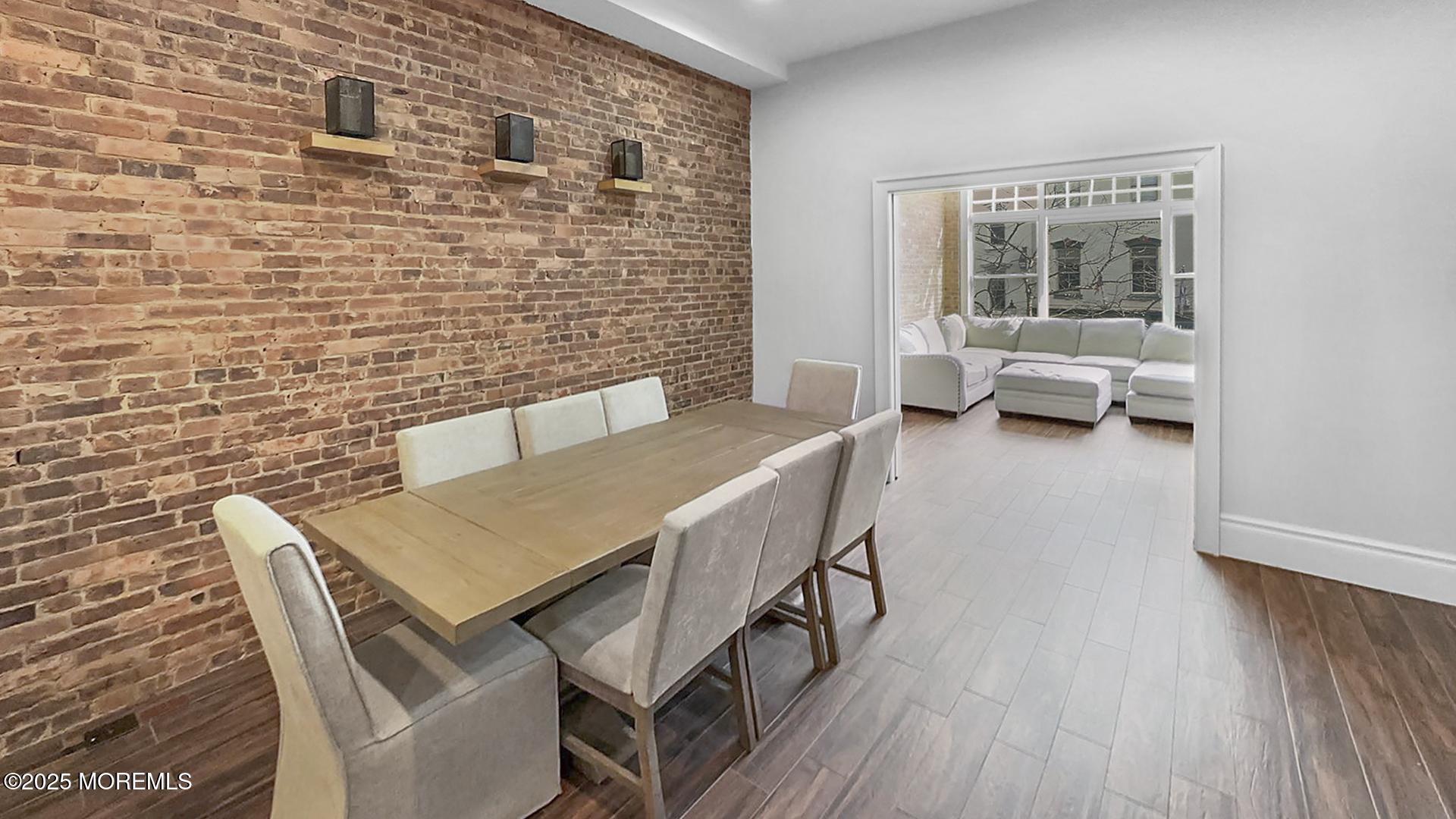 18 Broad Street, Unit 2F Red Bank, NJ 07701 - Photo 10 of 13 a backyard of a house with table and chairs