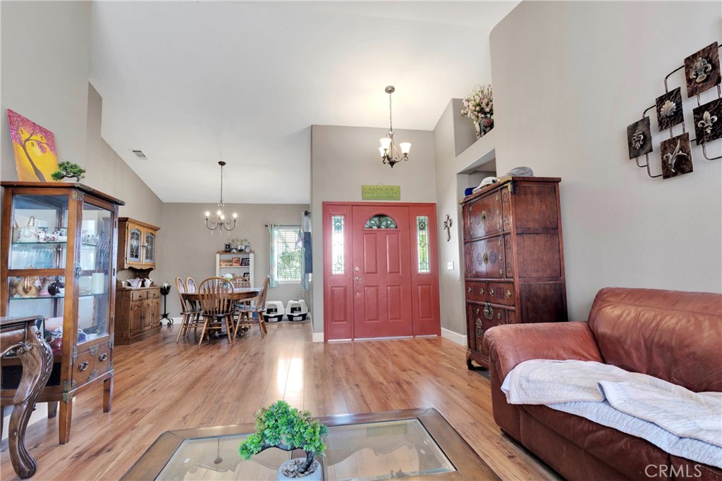 12949 Choco Road Apple Valley, CA 92308 - Photo 11 of 50 a living room with furniture and wooden floor