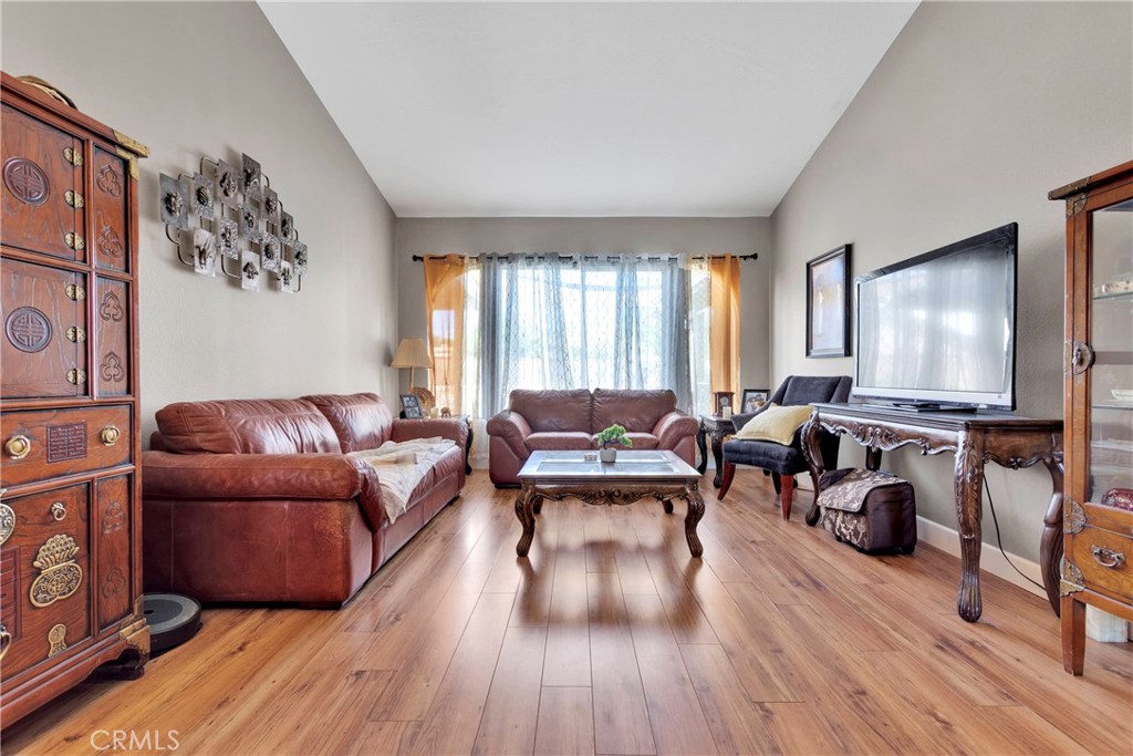 12949 Choco Road Apple Valley, CA 92308 - Photo 12 of 50 a living room with furniture and a wooden floor