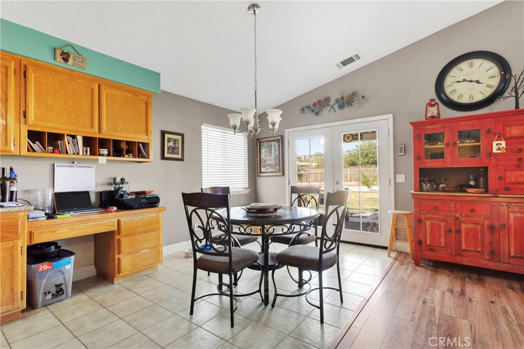 12949 Choco Road Apple Valley, CA 92308 - Photo 17 of 50 a view of a dining room with furniture window and wooden floor