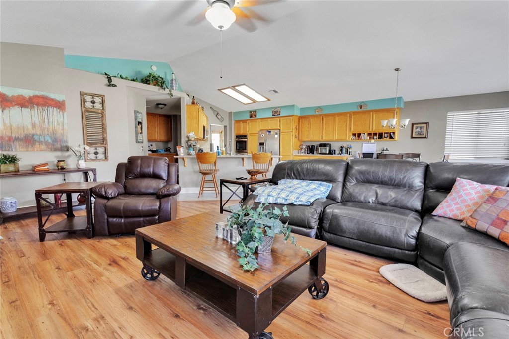 12949 Choco Road Apple Valley, CA 92308 - Photo 19 of 50 a living room with furniture and a large window