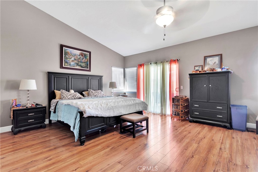 12949 Choco Road Apple Valley, CA 92308 - Photo 24 of 50 a bedroom with a bed and a dresser