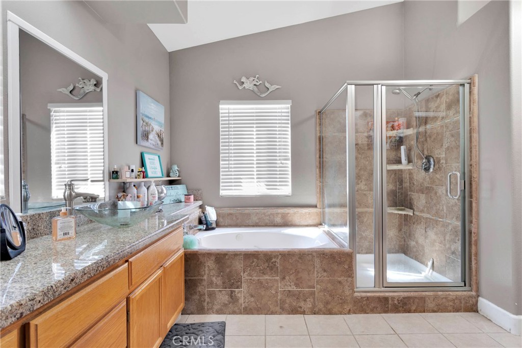 12949 Choco Road Apple Valley, CA 92308 - Photo 27 of 50 a spacious bathroom with sink shower and mirror