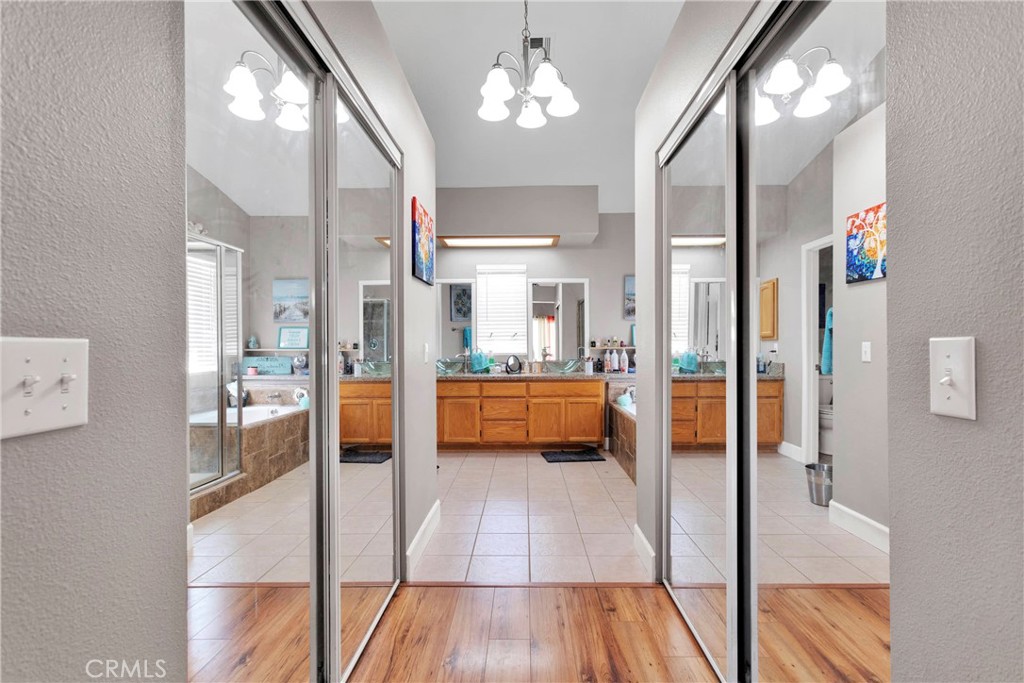 12949 Choco Road Apple Valley, CA 92308 - Photo 28 of 50 a spacious bathroom with a tub shower and sink