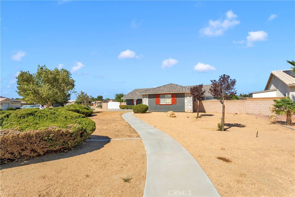 12949 Choco Road Apple Valley, CA 92308 - Photo 3 of 50 a swimming pool with a yard and seating space