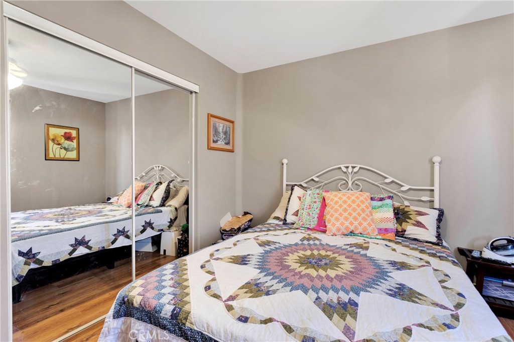 12949 Choco Road Apple Valley, CA 92308 - Photo 31 of 50 a bedroom with a bed and a table in it