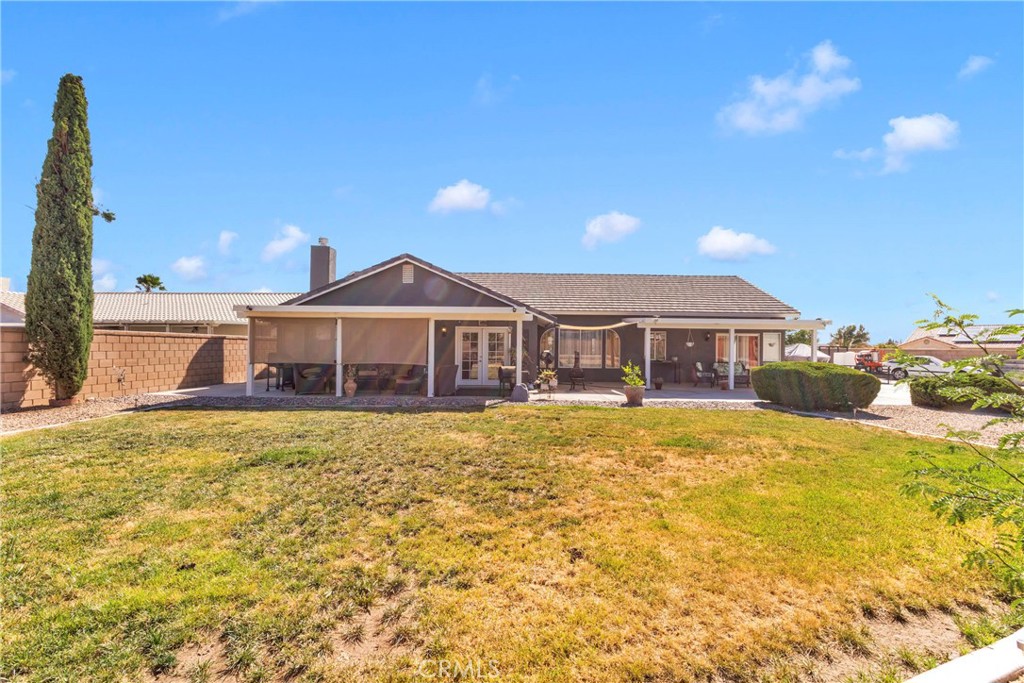 12949 Choco Road Apple Valley, CA 92308 - Photo 38 of 50 a front view of a house with a yard