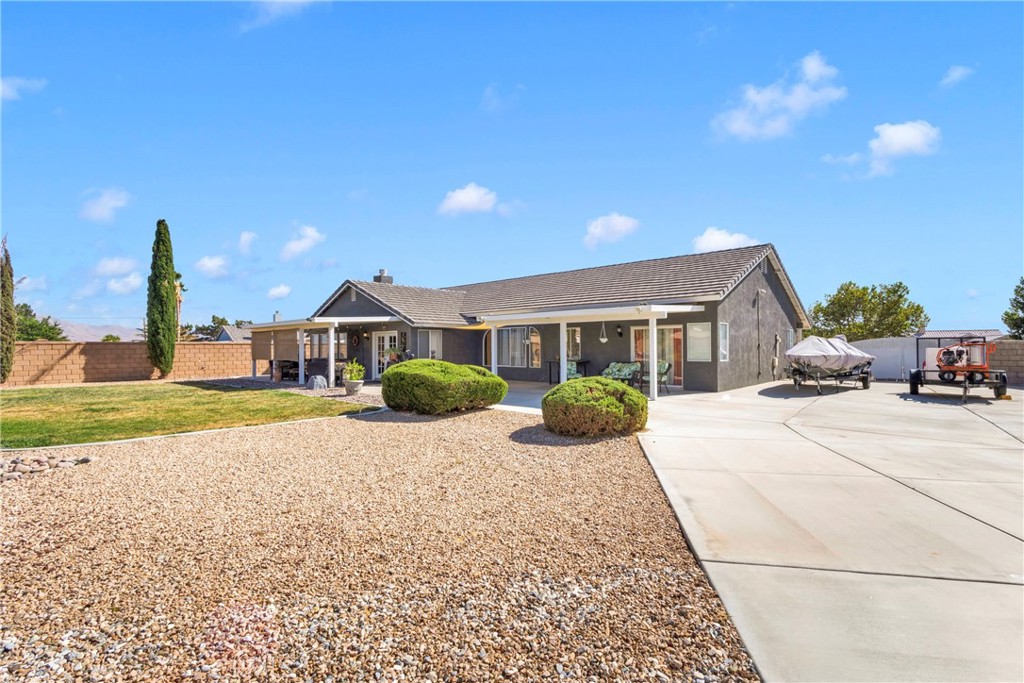 12949 Choco Road Apple Valley, CA 92308 - Photo 39 of 50 a view of a house with a patio