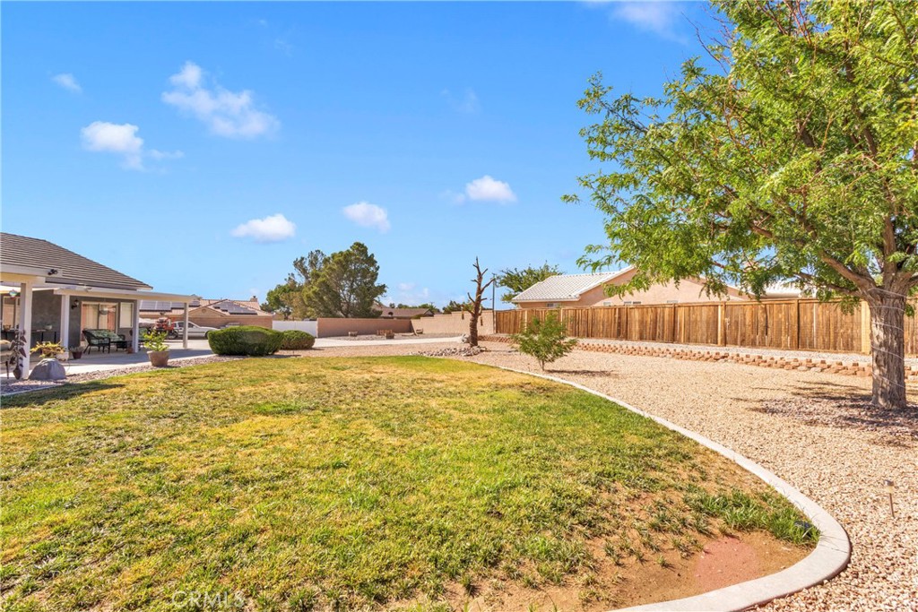 12949 Choco Road Apple Valley, CA 92308 - Photo 41 of 50 a swimming pool with outdoor seating and yard