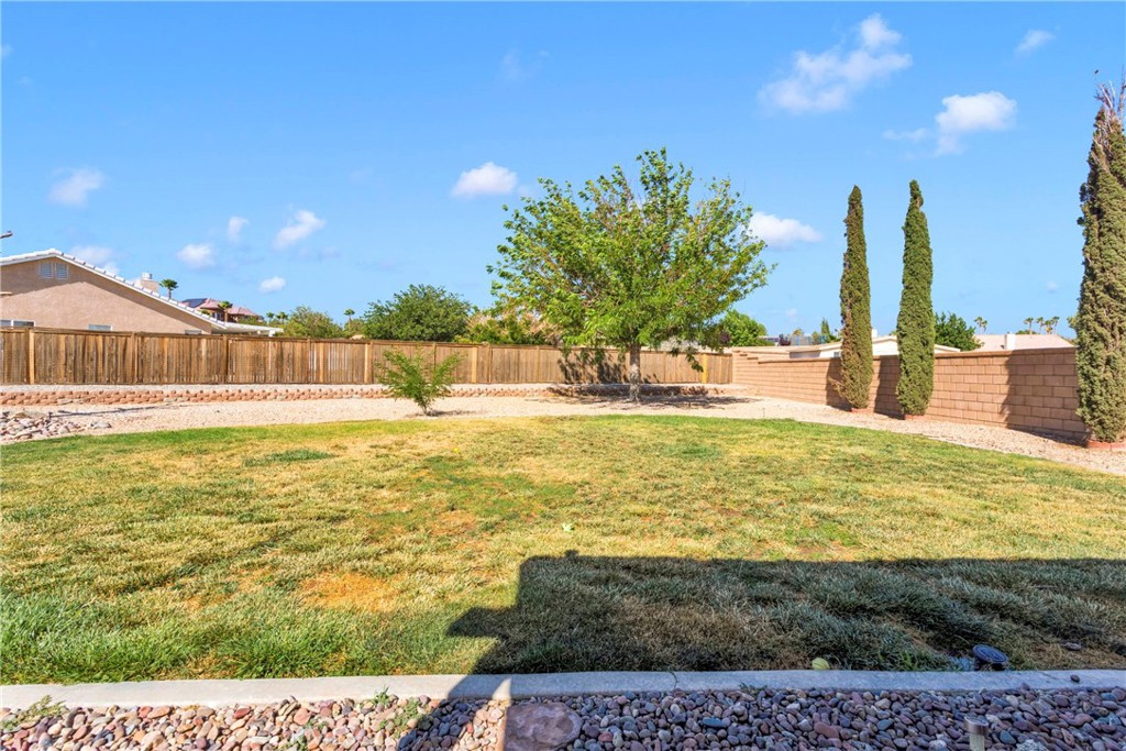 12949 Choco Road Apple Valley, CA 92308 - Photo 42 of 50 a swimming pool with outdoor seating and yard