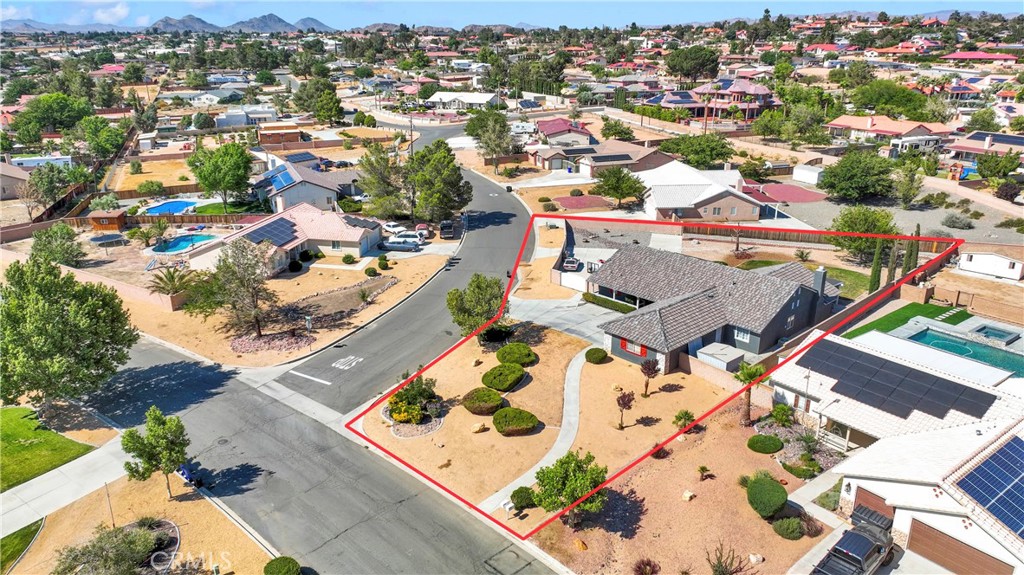 12949 Choco Road Apple Valley, CA 92308 - Photo 46 of 50 an aerial view of residential houses with outdoor space