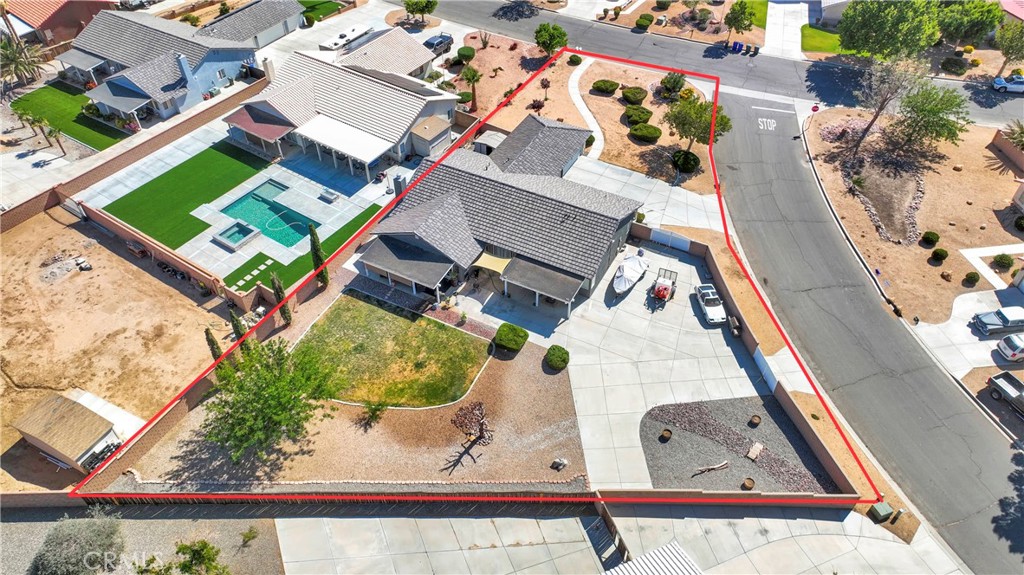 12949 Choco Road Apple Valley, CA 92308 - Photo 49 of 50 an aerial view of a house with a yard and lake view