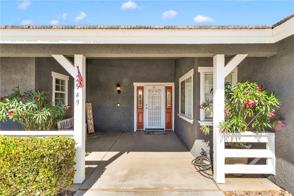 12949 Choco Road Apple Valley, CA 92308 - Photo 8 of 50 a front view of a house with a garden