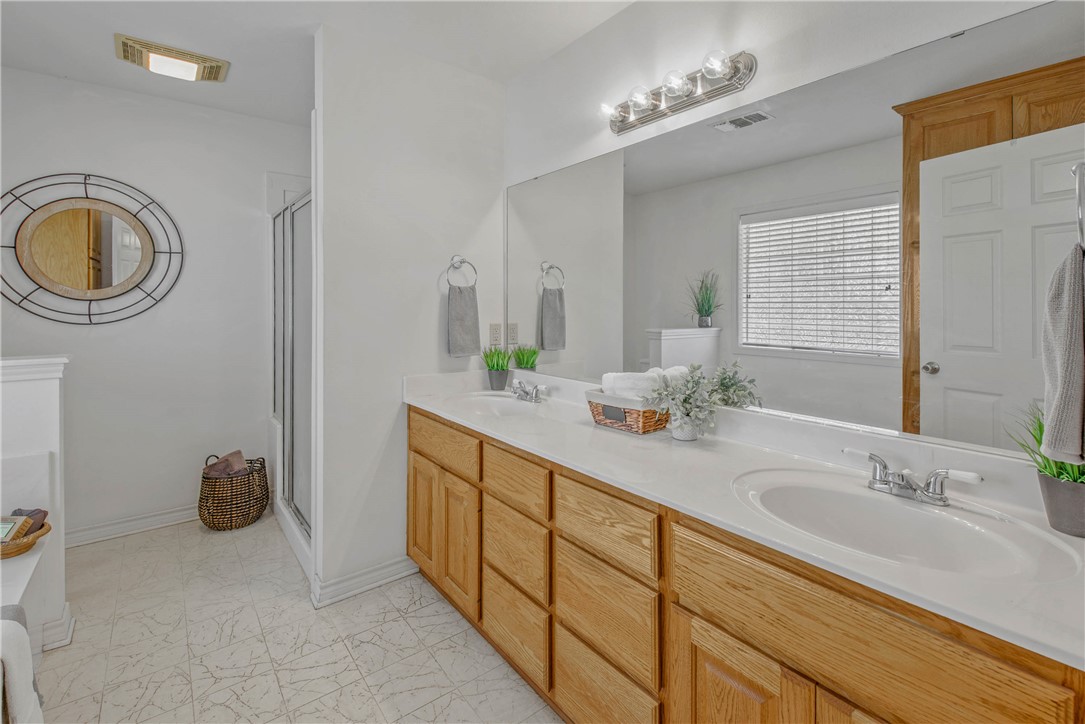 1110 County Road 439 Dime Box, TX 77853 - Photo 27 of 50 a bathroom with a sink and a mirror