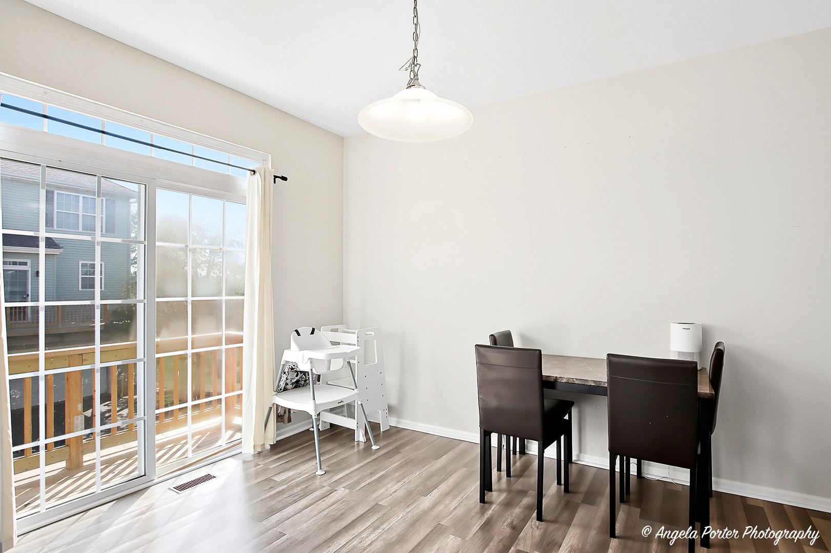1477 Sedgewood Court Round Lake, IL 60073 - Photo 12 of 29 a view of a dining room with furniture window and wooden floor