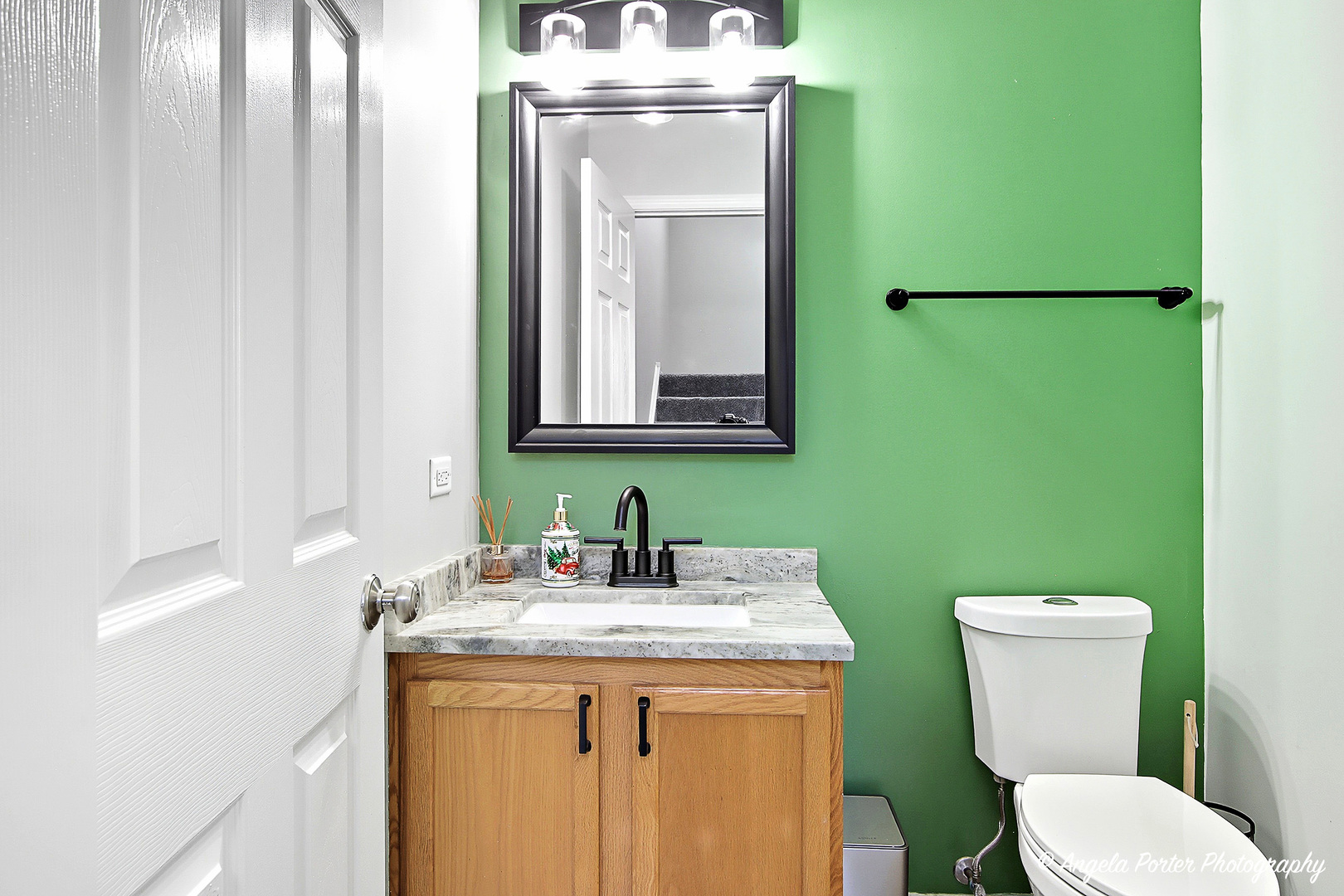 1477 Sedgewood Court Round Lake, IL 60073 - Photo 13 of 29 a bathroom with a toilet sink and mirror