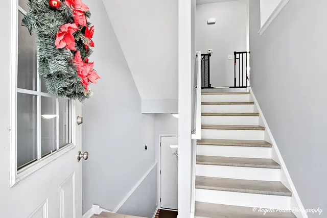a view of entryway with flower pots