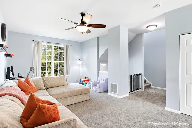 a living room with furniture and windows